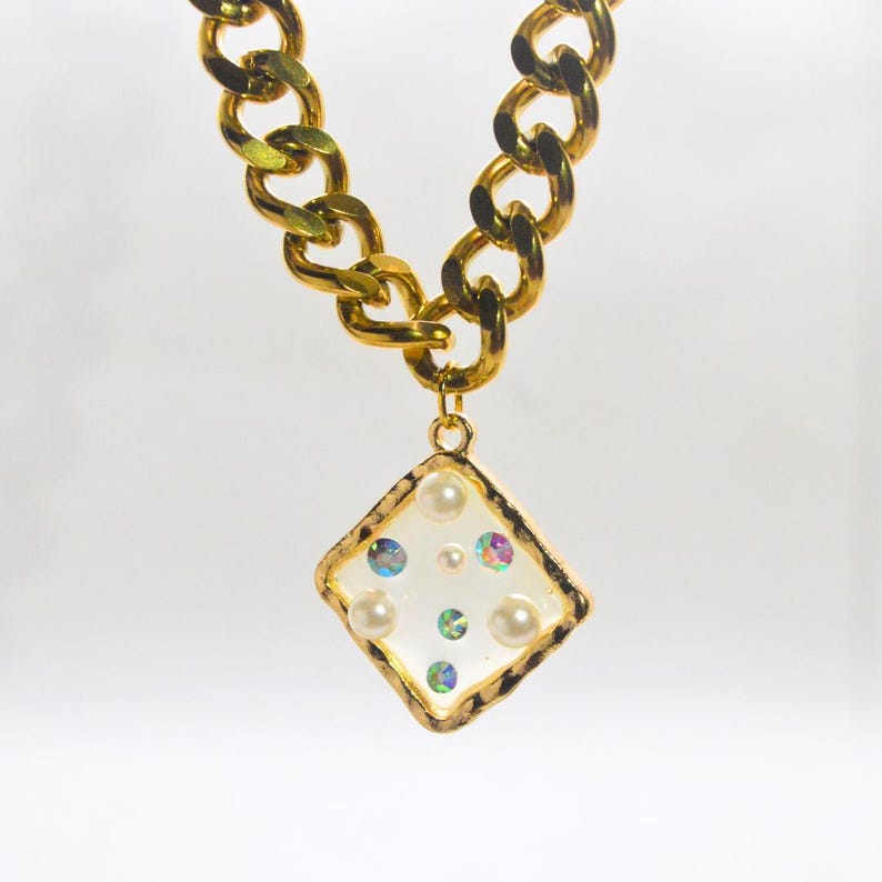 Square pendant with white beads and rhinestones