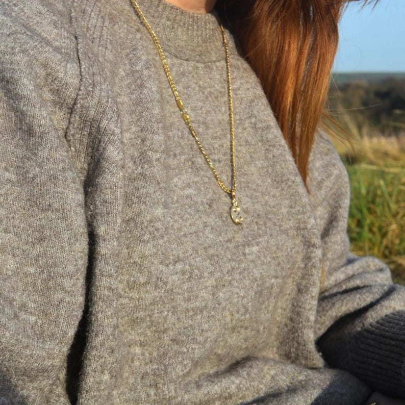 Gold chain necklace worn