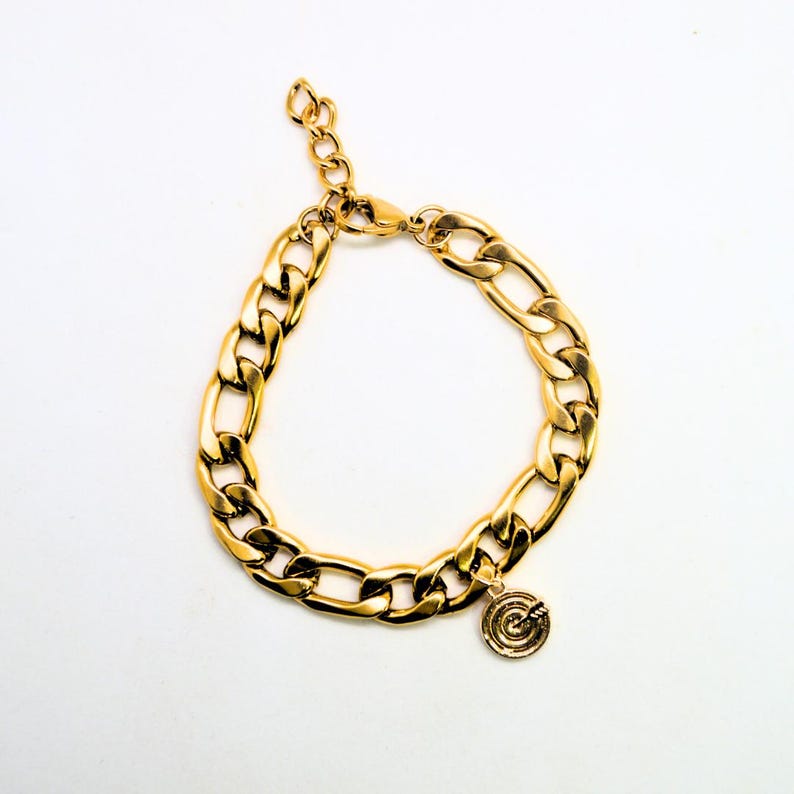 Chunky gold chain bracelet with a small charm