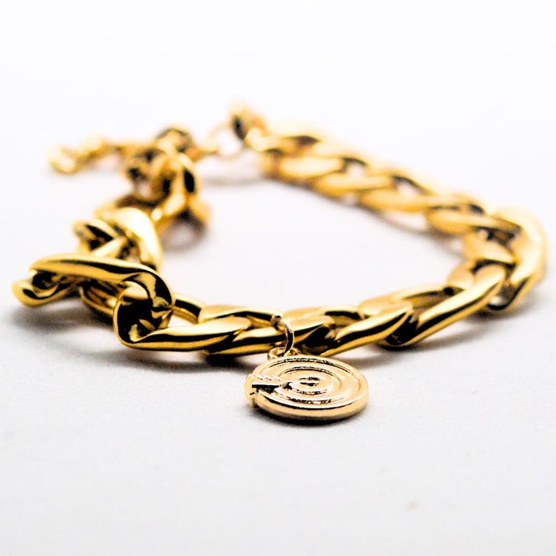 Chunky gold chain bracelet with a charm