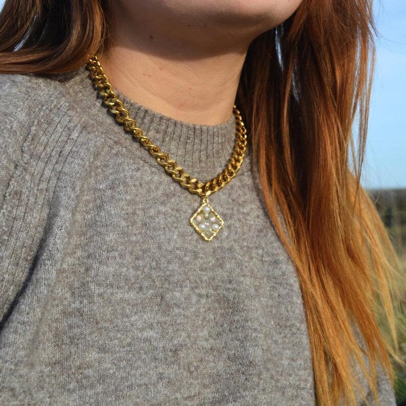 Gold chunky necklace with a square pearl and gem pendant