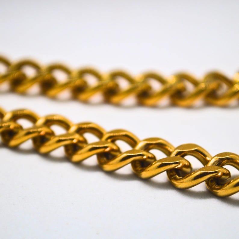 Gold chunky curb chain close up