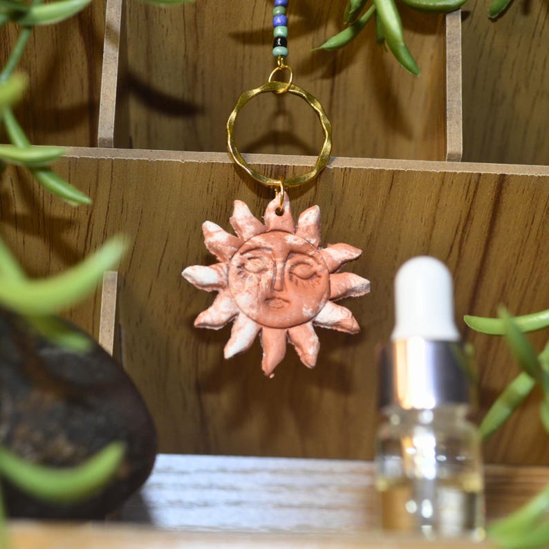 Marbled terracotta clay sun pendant