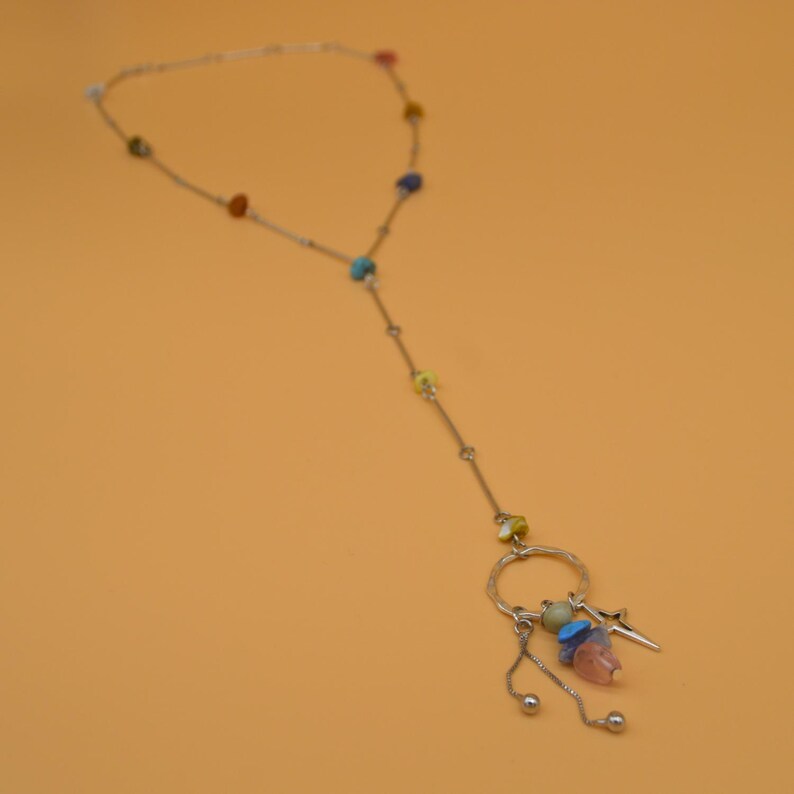 Multicoloured stone beaded necklace with three dangling charms