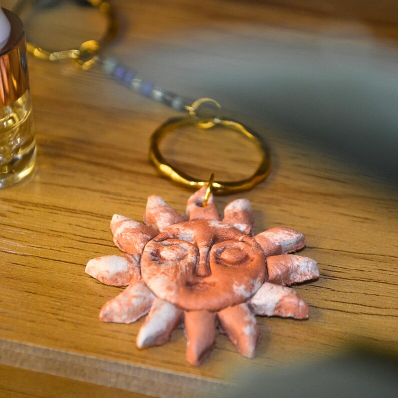 Weathered white finish sun pendant keychain
