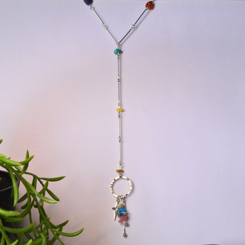 Multicoloured stone beaded necklace with three dangling charms