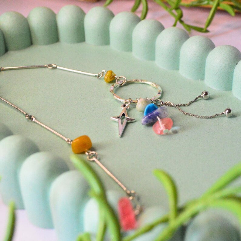 Multicoloured stone beaded necklace with three dangling charms